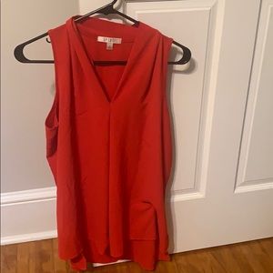 Red sleeveless blouse
